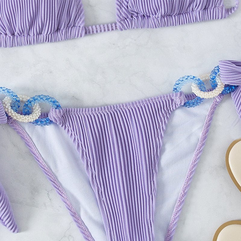 High-waisted bikini with decorative rings