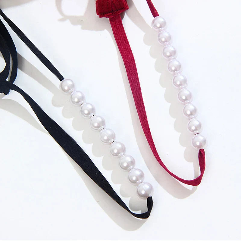 Thong with decorative pearls at the crotch